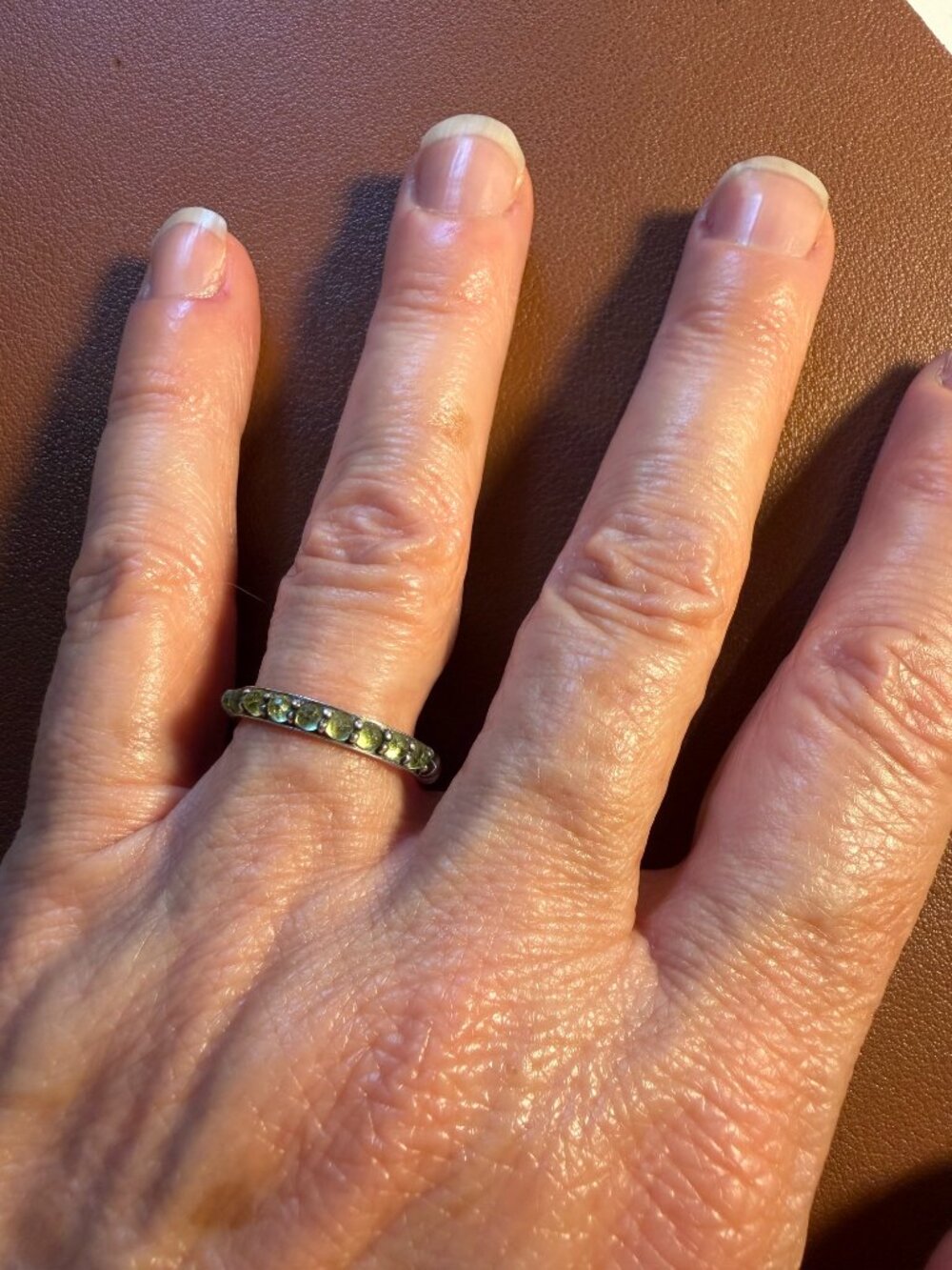 David Yurman sterling silver stackable ring with thirteen green peridot stones